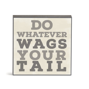 A small square cream wall art with the saying "Do whatever wags your tail".