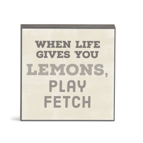 A small square cream wall art with the saying "When life gives you lemons, play fetch".