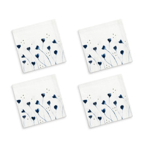 A set of four white cocktail napkins with a delicate blue floral illustration.