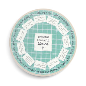 A green and white lazy susan with "grateful thankful blessed" and 12 different faith activities around the outside.