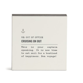 A white square wall art with the saying "RE: Out of Office Cruising on Out" with a short write up about someone going on a boat cruise.