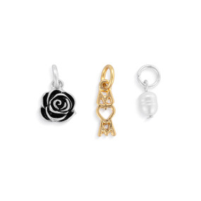 A set of three different gold and silver charms about mothers.