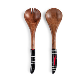 A set of two wood serving utensils with black handles with white lines and red hearts.