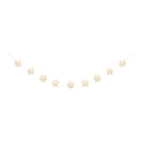 A holiday garland made out of white felt poinsettia flowers.