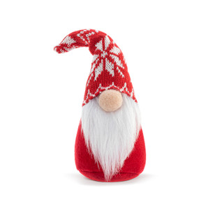 A small plush gnome figure in red fabric with a red and white knit hat and a long white beard.