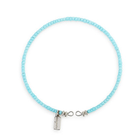 A round bracelet made of small light blue beads.