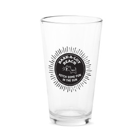 A clear pint glass with the saying "Bark-A-Lot Beach. Fetch some fun in the sun"