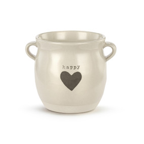 A cream ceramic planter with two small handles on the sides. The planter says "happy" and has a gray heart on the front.