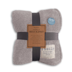A light gray blanket with a cream patch that says "family is the coziest place in the world... now scoot over". Folded and tied with a gray ribbon and cardboard tag.