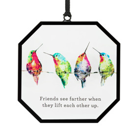 A hexagon shaped suncatcher with watercolor hummingbirds and the saying "Friends see farther when they lift each other up".
