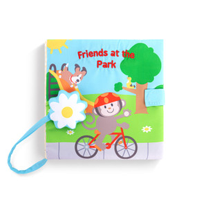 A fabric baby book with sounds called "Friends at the Park" with animals on the front.