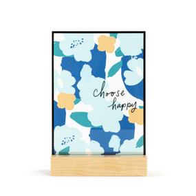A large rectangular suncatcher in a light wood base. The image is blue flowers and the saying "choose happy".