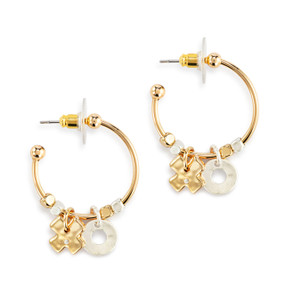 A pair of gold hoop earrings with gold and silver beads and two charms, a gold X and silver O.
