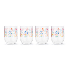 A set of four clear acrylic glasses with meadow flower patterns.