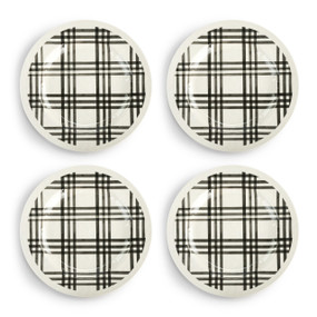 A set of four black and white plaid melamine dinner plates.