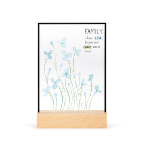 A large rectangular suncatcher in a light wood base. The image is light blue flowers and it says "Family where Love begins and Chaos never ends".
