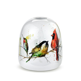 A white ceramic bud vase with watercolor songbirds sitting on a tree branch all around the vase.