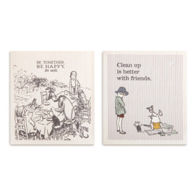 Two biodegradable dish cloths in gray and cream. One has illustrations of Christopher Robin and friends eating together with the saying "Be Together Be Happy Be Well" and the other has Christopher Robin and friends cleaning up and the saying "Clean up is better with friends".