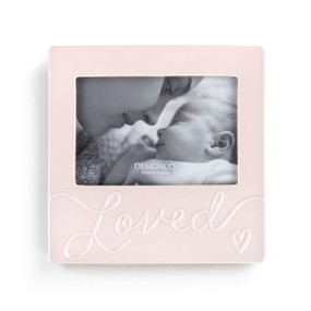 A light pink frame with a 4"x6" opening that says "Loved" at the bottom.