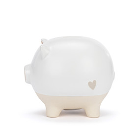 A white ceramic piggy bank with the face of a pig and a brown nose. The feet of the bank are cream and textured.