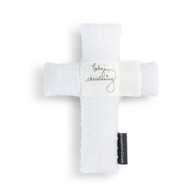 A white plush cross with the saying "baby's christening" in the middle.
