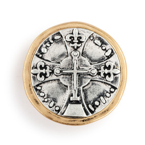 A round gold and silver metal visor clip with a silver image in the center of a cross.