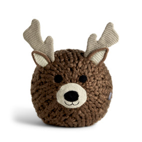 A brown knit round pillow pouf with the face of a reindeer with light brown knit ears and antlers.