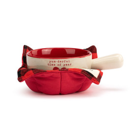 A cream handled soup bowl with a red interior inside a red fabric cozy. The bowl says "yum-derful time of year" with a red heart.