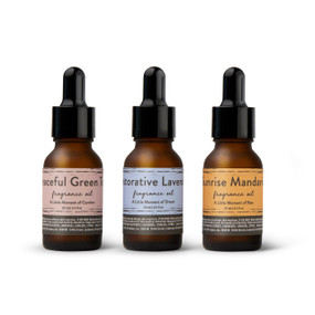 A set of three different essential oils in, green tea, lavender and mandarin.
