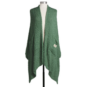 A green shawl with two front pockets displayed on a mannequin.