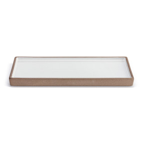 A white ceramic rectangular tray with a tan textured outside, displayed at an angle to show depth.