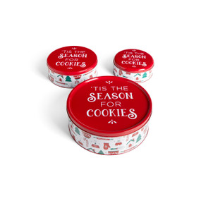 A set of three different sized red and white round metal cookie tins. The tin has holiday baking images around the outside and the lids say "'Tis The Season For Cookies".