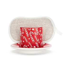 A red ceramic soap dish with a white candy cane illustration and a tan sponge in the open slot.