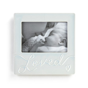 A light blue frame with a 4"x6" opening that says "Loved" at the bottom.