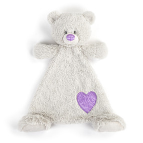 A cream blankie with the face of a bear that has a light purple nose. The blankie has a light purple fabric heart shaped patch near the foot.