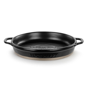 A round black ceramic pie dish with a tan textured base, handles on the sides and the saying "Slice Happy" on the side.