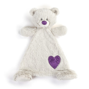 A cream blankie with the face of a bear that has a purple nose. The blankie has a purple fabric heart shaped patch near the foot.