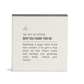 A white square wall art with the saying "RE: Out of Office Deep Sea Fishin' for Me" with a short write up about someone deep sea fishing.