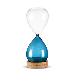 A glass sand timer with blue glass on the bottom half sitting in a wood base that reads "downtime with dad".