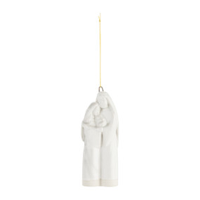 A white stoneware hanging ornament of the Holy Family.