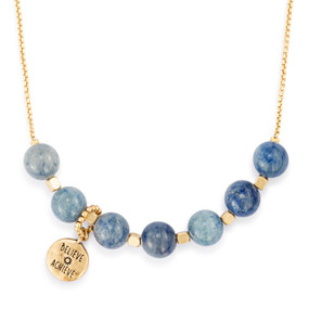 An adjustable gold chain necklace with seven gold and indigo beads spaced on it with a charm saying "Believe Achieve" that can move across the beads to track habits.