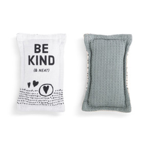 A set of two fabric kitchen sponges. On has black heart artwork and the saying "Be Kind (& Neat) and the other is gray.