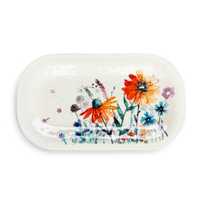 A white melamine rectangular platter with a colorful meadow flowers pattern on top.