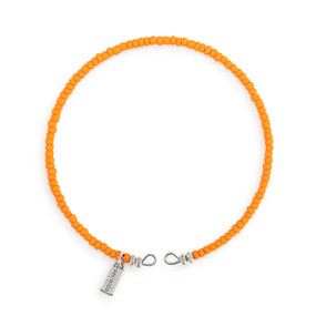 A round bracelet made of small orange beads.