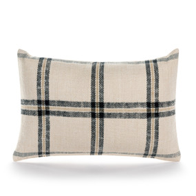 A cream lumbar pillow with a black and brown plaid pattern.