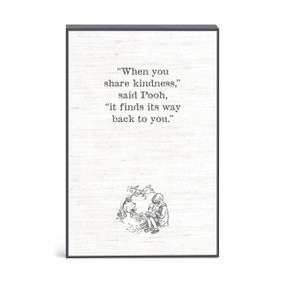 A wall art of Winnie-the-Pooh and Christopher Robin with a message about sharing kindness.