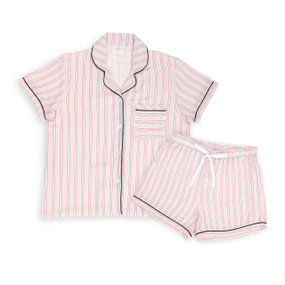 A medium sized pink striped pajama set with a short sleeve button down top and shorts with a white tie.