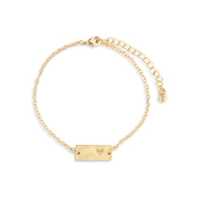 An adjustable gold chain bracelet with a rectangular gold charm with a heart on it.