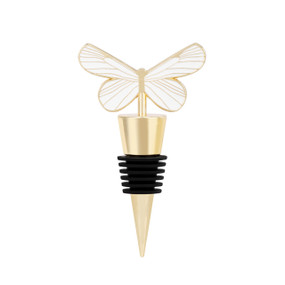 A gold bottle stopper with a cream and gold butterfly at the top.