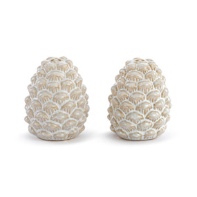 A set of cream ceramic salt and pepper shakers shaped like pinecones.